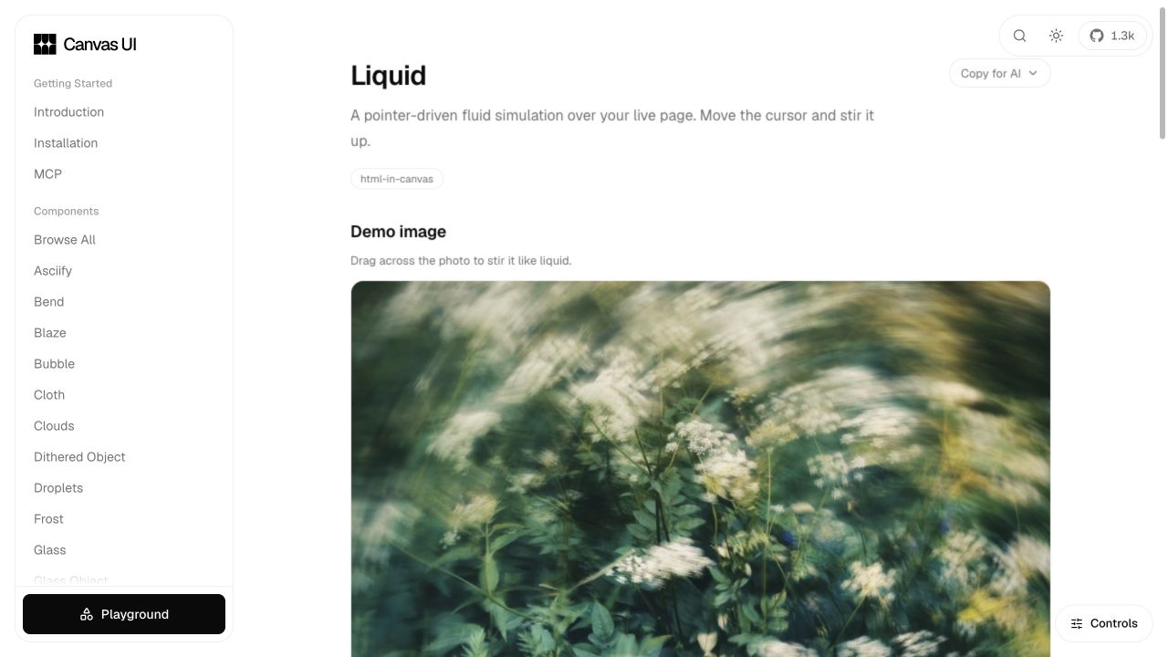 The Canvas UI Liquid demo distorting a photograph with a pointer-driven WebGL fluid simulation