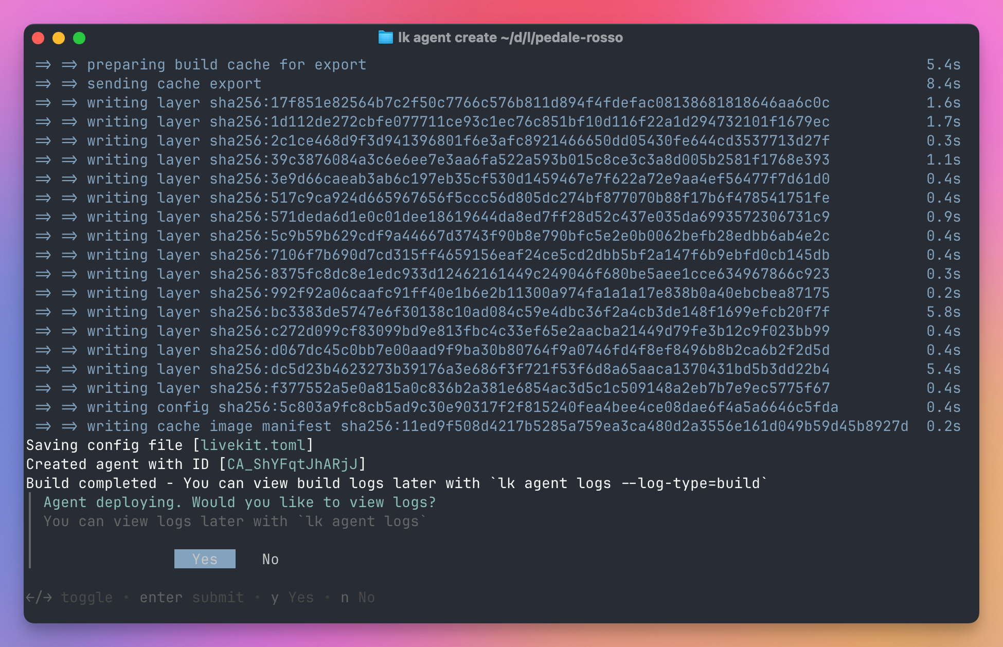 A completed agent build showing the new agent ID, saved livekit.toml file and the prompt to view deployment logs